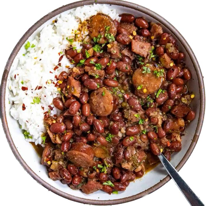 A bowl of red beans and sausage over white rice